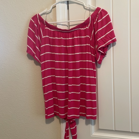Pink off the shoulder top with white stripes. Sleeves have a pretty flow to them